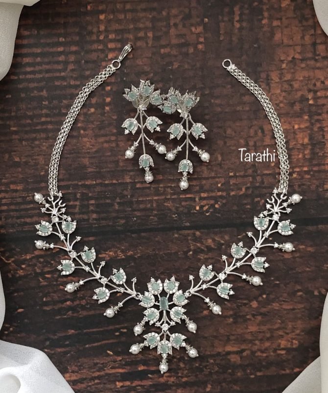 Trendy silver finish White and Green stone AD Partywear Neckset.